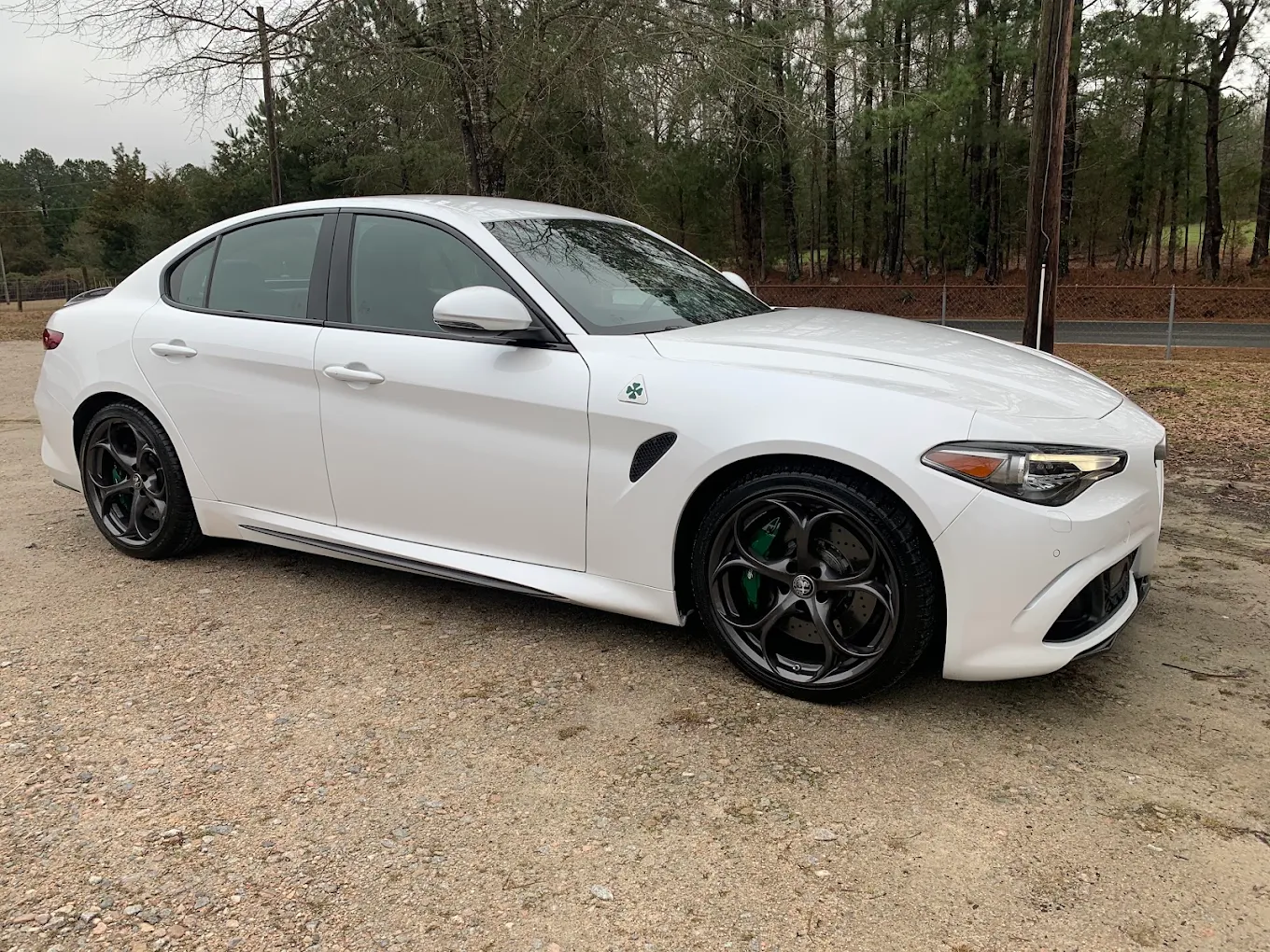 White Alfa Romeo with a clean, finished exterior