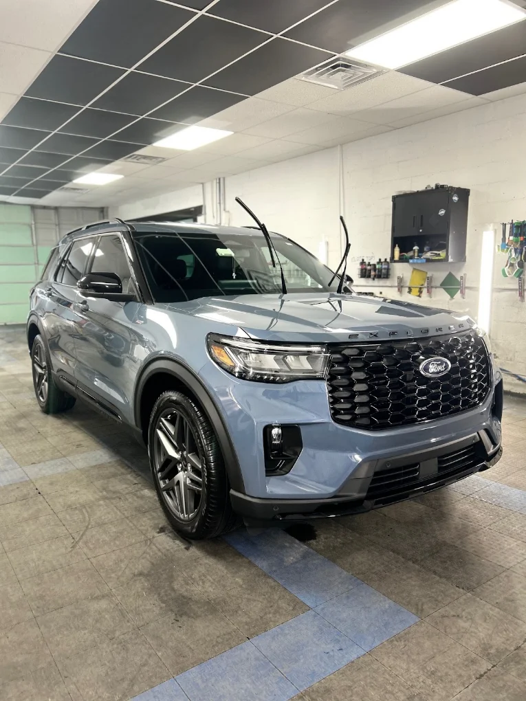 Freshly detailed Ford Explorer exterior inside the WashNWerk shop